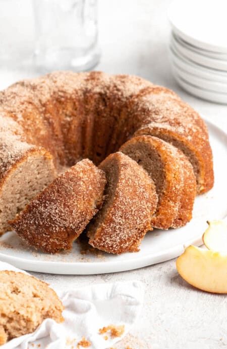 A close up of apple cider donut cake ready to serve Apple Cider Bundt Cake, Cider Bundt Cake, Cider Donut Cake, Apple Cider Donut Cake, Delicious Thanksgiving Desserts, Apple Cider Syrup, Thanksgiving Dessert Recipes, Grandbaby Cakes, Cake Apple