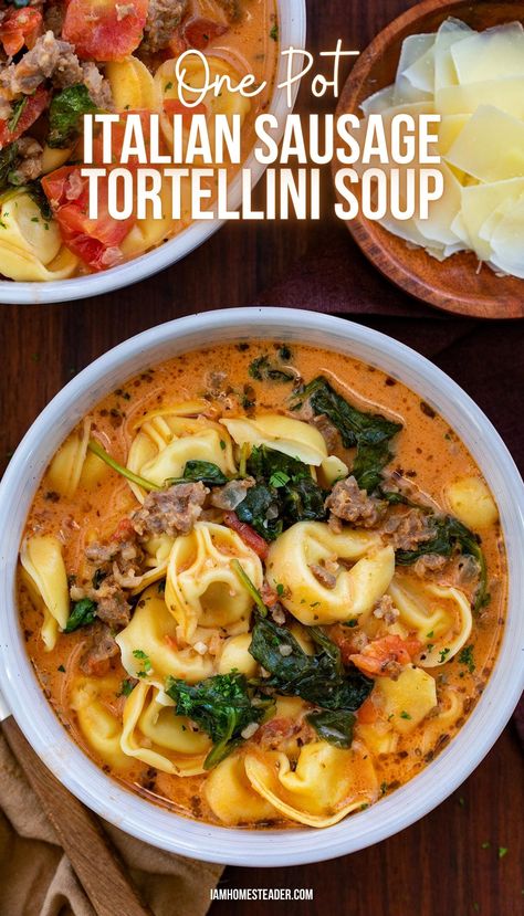 A white bowl filled with Italian Sausage Tortellini Soup, next to it, a second bowl of soup and a wooden bowl of shaved parmesan cheese. Tortellini Soup With Sausage And Arugula, Tortilla Sausage Soup, One Pot Italian Sausage Tortellini Soup, Rustic Tortellini Soup Italian Sausages, Creamy Sausage Spinach Tortellini Soup, Italian Sausage Tortilla Soup Recipe, Tortelinni Soup With Italian Sausage, One Pot Sausage Tortellini Soup, Tortolini Soup Sausage