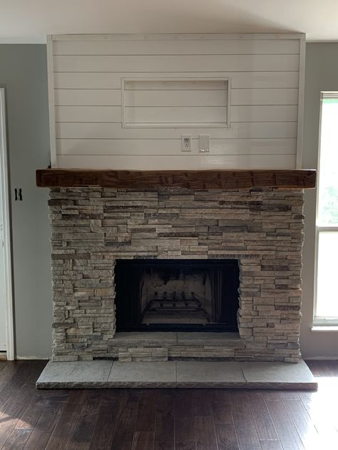 We updated our fireplace surround, removed old brick and installed new stacked stone, mantle, hearth, shiplap and electric for TV. Fireplace Stone Floor, Stone Fireplace And Mantle Ideas, Shiplap Fireplace With Stone Surround, Shiplap Wall With Stone Fireplace, Fireplace With Stacked Stone, Shiplap And Brick Wall, Gas Fireplace Stone Surround, Fireplace Stacked Stone Ideas, Hearth Stone Fireplace