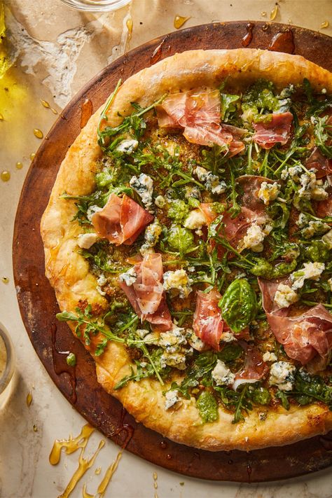 Pesto Prosciutto Pizza is a dreamy homemade pizza made with fragrant basil pesto, garlic, fresh greens, savory prosciutto, crumbled blue cheese and our Italian Pizza Dough Kit. Prosciutto Pizza Recipes, Cast Iron Pizza Recipe, Gourmet Pizza Recipes, Pizza With Pesto, Pesto Pizza Recipe, Basil Pizza, Pizza Oven Recipes, Prosciutto Pizza, Shredded Bbq Chicken