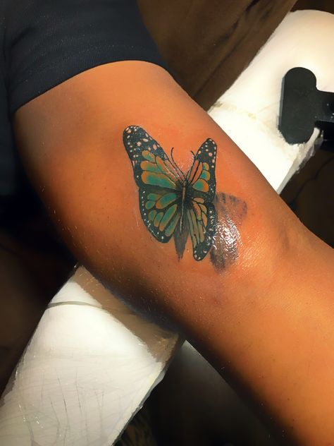 Butterfly colour tattoo on Dark skin Colorful Butterfly Tattoo On Dark Skin, Butterfly Tattoo Dark Skin, Green Tattoo On Dark Skin, Butterfly Tattoo On Dark Skin, Color Tattoos On Dark Skin, Butterfly Tats, Tattoo On Dark Skin, Tattoos On Dark Skin, Yellow Butterfly Tattoo