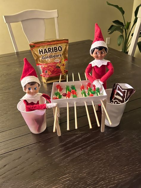 Elf On The Shelf Apples, Elf On The Shelf Playing Foosball, Fruit Loops Elf On The Shelf, Elf On The Shelf Ideas Gummy Bears, Elf On The Shelf With Treats, Elf Foosball, Elf Treats For Kids, Elf On The Shelf Ideas With Candy, Football Elf On The Shelf