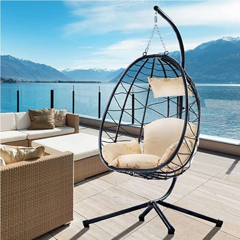 Fun for way to add to your outdoor space! This hanging chair with stand has the characteristics of wear and corrosion resistance, you can put it patio, backyard. The simple style of the basket chair can easily match each other with the furniture in the bedroom living room. Patio Hanging Chair, Indoor Swing Chair, Hanging Chair With Stand, Basket Chair, Hammock Stands, Swing Chair Outdoor, Indoor Swing, Hanging Hammock Chair, Hanging Egg Chair