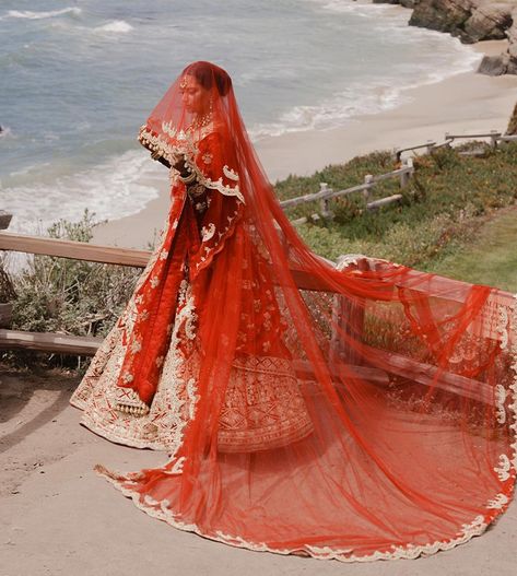 The red colour comes with an array of shades, and each one of them always fills our hearts with a lot of grandeur. Even though the other colours from the palette are seen taking centre stage in weddings nowadays, however, the red-coloured ensembles may never fade away from Hindu weddings. This is because it carries a sense of tradition and royalty imbibed in it, and every bride donning red wedding outfits looks no less than a queen.    Moreover, the red colour has also seeped into the br Manish Malhotra Bridal Collection, Manish Malhotra Bridal, Tulle Lehenga, Red Wedding Lehenga, Hindu Weddings, White Sari, Red Veil, Anand Karaj, Fashion Illustration Tutorial