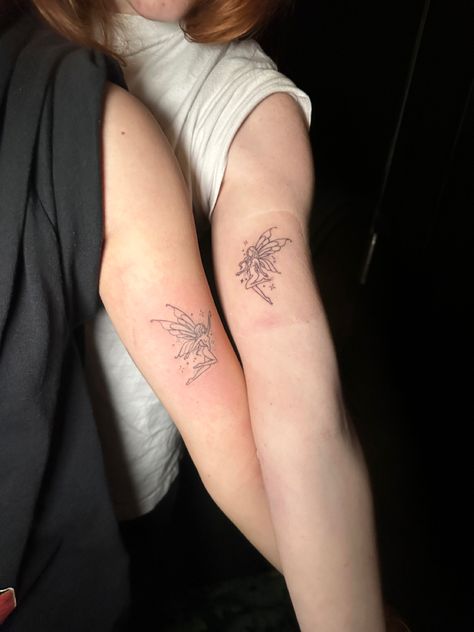 Fairy Tattoo For Best Friends, Fairies Holding Hands Tattoo, Fairy Tattoo Unique, Fairy Couple Tattoo, Upper Arm Fairy Tattoo, Fairy And Sun Tattoo, Fairy Reaching Up Tattoo, Tony Matching Tattoos, Fairy Friends Tattoo