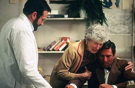 Awakenings (1990). This is a behind-the-scenes still photograph from the movie. L to R: Dr. Malcolm Sayer is played by Robin Williams, Mrs. Lowe is played by Ruth Nelson, and Leonard Lowe is played by Robert De Niro. This movie is based on the non-fiction book Awakenings (1973) by Oliver Sacks. Oliver Sacks, Awakenings Movie, Tv Miniseries, Robin Williams, Non Fiction, Nonfiction Books, Fiction Books, The Movie, Movies And Tv Shows