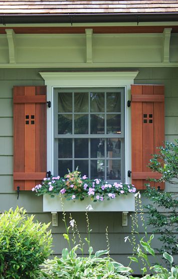 CURB APPEAL – another great example of beautiful design. Cape cod home renovated into craftsman style home. The homeowners of a 1930s cape-style home that had been remodeled and expanded several times before they purchased it wanted an exterior face lift that would upgrade and unify the home's aesthetics while adding much needed functionality. Shutters And Flower Boxes, Simple Shutters, Shutters Diy, Framed Windows, Cape Style Homes, Green Window, Exterior Window, House Shutters, Diy Shutters