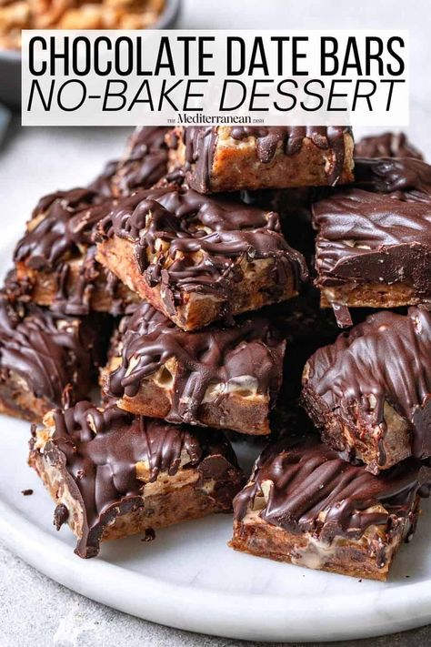 Date bars with tahini, chopped walnuts, and dark chocolate make for a delicious and nutritious no bake dessert recipe. Date Recipes Desserts, Date Bars, The Mediterranean Dish, Gourmet Popcorn, No Bake Bars, Bake Dessert, Mediterranean Dishes, Baked Dessert Recipes, Healthy Sweets Recipes