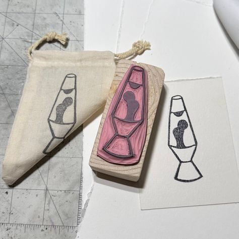 Stamp area measures approximately 2.75 inches x 1 inch. Rubber is mounted on a pine block that is the approximate size of the stamp. The design of the stamp is on the top of the wood for an added visual. "Lava Lamp Groove" - Hand Carved Rubber Stamp for Retro Enthusiasts Step back in time with my hand carved 'Lava Lamp Groove' rubber stamp, a nostalgic ode to the whimsical and iconic 1960s and 1990s designs. This unique stamp caters to those who cherish the vibrant aesthetics of the past and the eccentric, eye-catching allure of lava lamps. Crafted with love in Laurel, Mississippi, each stamp is meticulously carved on rubber and mounted on a solid pine block. The design is clearly displayed on the top side of the block, making it easy to identify and use. It comes in a bag with the lava la Simple Print Making Designs, Stamp Shirts, Lava Lamp Embroidery, Print Making Designs Easy, Tiny Lava Lamp Tattoo, Rubber Stamp Ideas, Eraser Stamp Ideas, Eraser Prints, Easy Lino Print Ideas