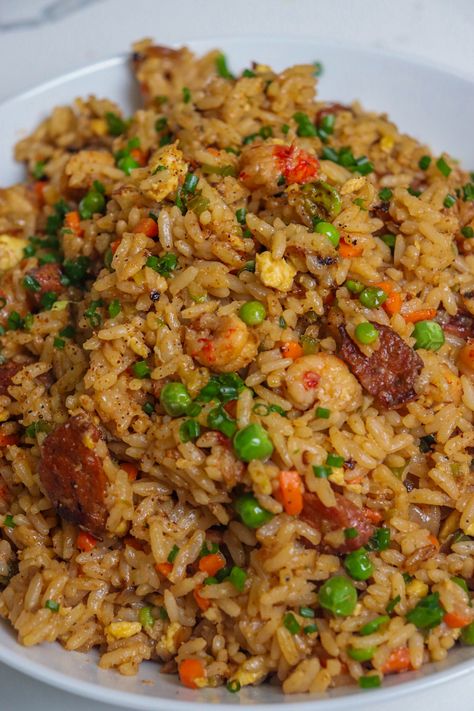 Culinary+Fusion:+The+Bold+Flavors+of+Cajun+Fried+Rice Creole Fried Rice, Cajun Shrimp Fried Rice Recipe, Cajun Rice Recipes, Crawfish Fried Rice, Cajun Fried Rice, Cajun Rice Recipe, Seafood Fried Rice, Cajun Rice, Rice Meals