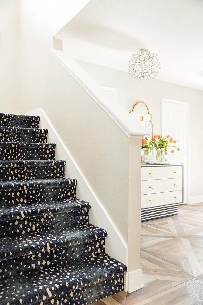 If I have said it once, I have said it a million times, that animal prints are neutral to me. I think animal prints can be used in almost any room to add another layer of pattern and texture. In this example, you can see a small peak of an antelope print carpet. This is a great way to add a pop of animal print to a space in a surprising and unexpected way. A standard builder basic set of stairs got the wow factor with the blue antelope print carpet. Stairway Carpet, Patterned Stair Carpet, Animal Print Carpet, Animal Magnetism, Built In Bookcase, Buying A New Home, Stair Runner Carpet, Carpet Stairs, Home Upgrades