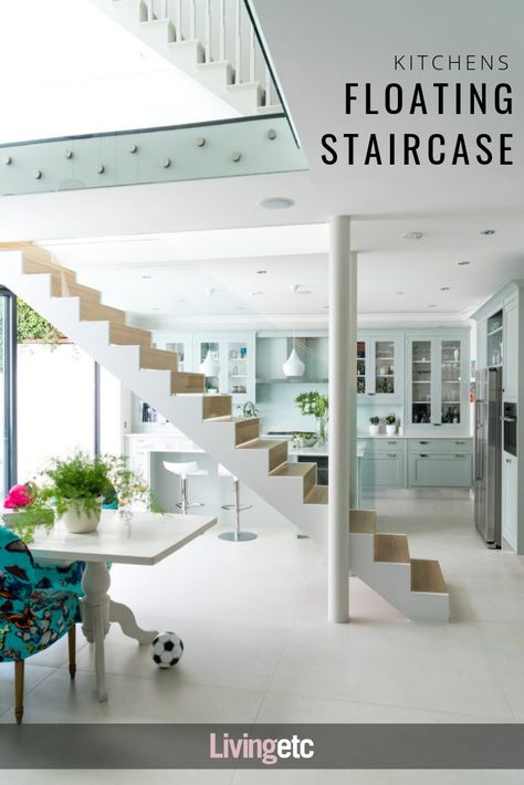 Slender gaps in the wood risers let slivers of sunlight shine through the suspended glass-clad staircase, adding to the feeling of lightness and space. #kitchendesign #whitekitchen #interiordesign Kitchen Diners, Modern Kitchen Open Plan, Stairs In Kitchen, Tropical Living, Open Staircase, Floating Staircase, Interior Stairs, Modern Staircase, House Stairs