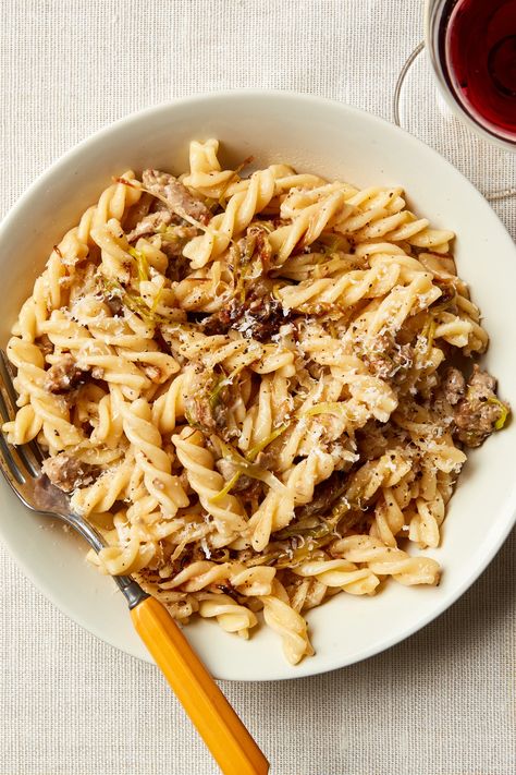 The sweetness of leeks and the savoriness of pork sausage make a wonderful combination in this pasta dish from Giuliano Hazan. The sauce is equally good with the long telephone-cord-shaped fusilli or the short spiral fusilli. Celina Sharma, Easy Entrees, Spring Cooking, Rice And Potatoes, Delicious Pasta Recipes, Pasta Restaurants, Leek Recipes, Sausage Pasta Recipes, Favorite Pasta Recipes