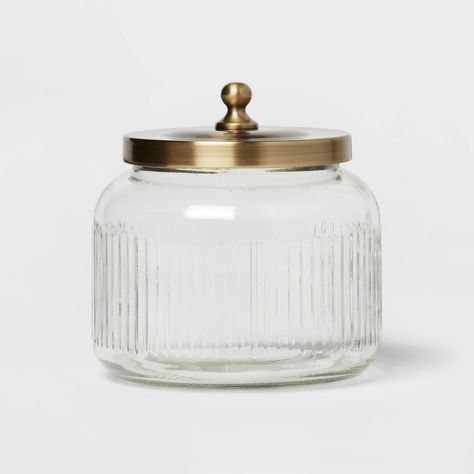 Go classic in your bath space with this Small Glass Bath Canister from Threshold™. This small bath canister features a jar-like shape with a brass-finish lid for a beautiful look. The canister is made with glass and features a ribbed design to add an appealing look to your bathroom decor. You can use the glass bath canister to store those small items you want close at hand — just add a large bath canister to create a coordinating look in your bathroom. Threshold™: Looks like home, feels like you Glass Jars For Bathroom, Glass Storage Jars Bathroom, Decor On Toilet Tank, Laundry Room Canisters, Bloxburg Farmhouse, Bath Salt Containers, Target Bathroom, Farmhouse Bathroom Accessories, Counter Storage