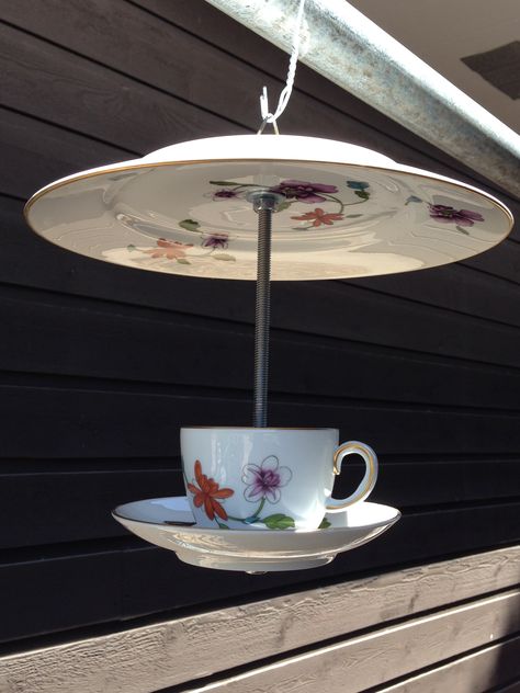 Bird feeder I made from a dinner plate cup and saucer. Teacup Bird Feeder Diy, Recycled Glassware, Tea Cup Decor, Tea Cups Diy, Cup And Saucer Crafts, Unique Bird Feeders, Glassware Garden Art, Teacup Crafts, Bird Feeding Station