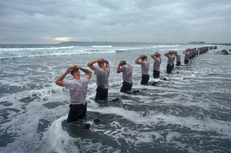 Some highlights from the Navy SEAL workout:    getting “drown-proofed”: swimming with bound arms and legs  “surf torture” (official name: water immersion): a prolonged bob in the 60-degree Pacific Ocean  jumping on and off a pier while being hosed down with cold water  retrieving a raft from a distant shed and supporting the 150-pound object—packed with paddles and gear—on your head  “Hell Week,” a five-day regime of simulated battle stress—and less than four hours of sleep a night  more than 15 Navy Seal Workout, Navy Seal Training, Seal Training, Us Navy Seals, Military Quotes, Bin Laden, Navy Seal, Special Ops, Military Life