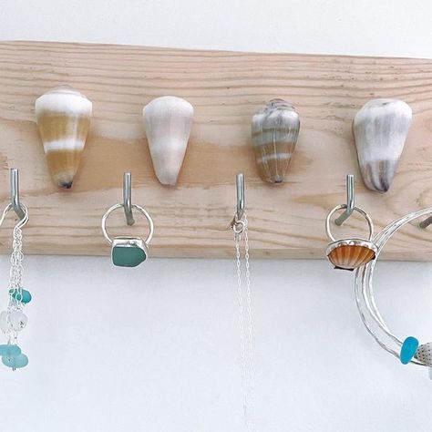 Sea Kissed By Kris • Handcrafted Jewelry on Instagram: "These Hawaiian Cone Shell Jewelry Holders are a cute way to organize + display your favorite beach bangles, rings, necklaces and earrings…and they’re $10 OFF now!! Shown Here Jewelry Holder Triple Sea Glass Earrings Sea Glass Ring Sea Glass Bezel Necklace Sunrise Shell Ring Beach Bangles Order Online www.seakissedbykris.com #jewelryholder #shellart #jewelryorganization #homeorganization #bedroomorganization #simplifylife" Shell Beads Jewelry, Jewelry Booth, Sunrise Shell, Artisan Market, Coastal Jewelry, Cone Shell, Sea Glass Ring, Jewelry Holders, Bezel Necklace