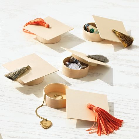 Cute for a graduation party: mortarboard box favors, each one filled with a tiny gift.