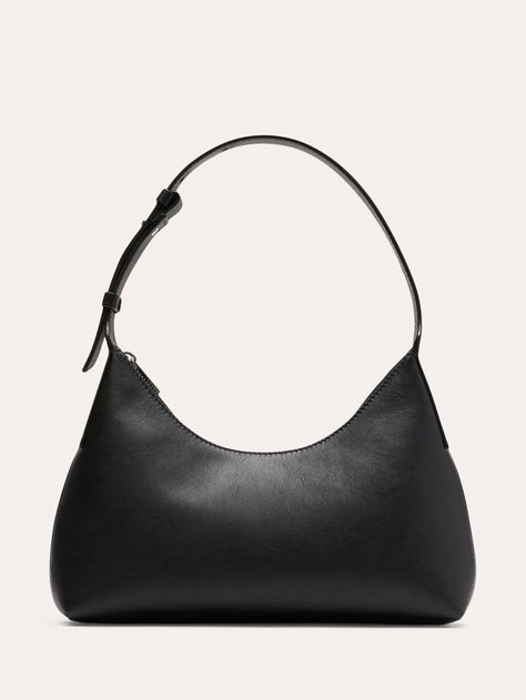 An ode to the 90s minimalist trend, this shoulder bag is cut in a silhouette that hovers somewhere between half-moon and triangle.  Here, we added an adjustable strap and zip closure, keeping the styling sleek to showcase this beautiful leather.  Zip-top closure.  Adjustable shoulder strap.  Height: 7. 7" Width: 11" Depth: 2. 4" Small Black Shoulder Bag, Ford Aesthetic, Euro Winter, Look Expensive On A Budget, Drippy Fits, How To Look Expensive, Budget Outfits, Look Expensive, Xmas List