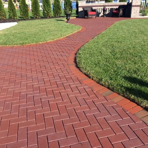 English Edge Burgundy clay paver walkway. Brick Paving Driveway, Curved Herringbone Brick Walkway, Basketweave Brick Walkway, Concrete Driveway With Brick Inlay, Red Pavers Brick Exteriro, Unique Patios, Clay Pavers, Walkway Design, Paver Designs