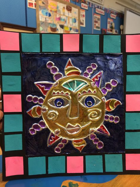 2nd Grade Aztec suns (foil relief, radial symmetry, pattern, mosaic) Mexican Sun Art Lesson, Mexican Art Lessons Elementary, Aztec Sun Art, Mexican Sun Art, Aztec Crafts, Sun Patterns, Inca Art, Radial Symmetry, Aztec Sun