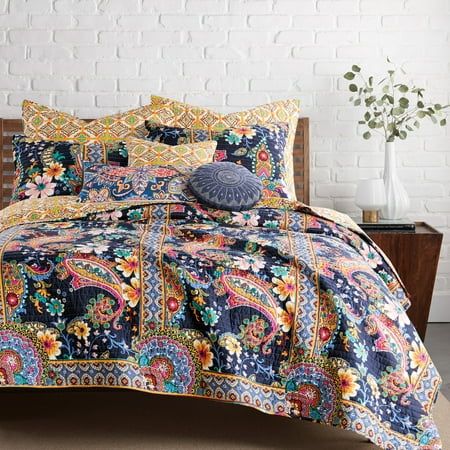 The Bertelli Navy Reversible King Quilt Set by Levtex Home is inspired by regal European wallcoverings and tapestries. Offered in navy, pink, ochre, blue teal, green and white, this design will immediately transform your bedroom. This reversible quilt features an array of bright flowers offset with distinctive vertical borders on the front, reversing to a small medallion tile on the back. The King Quilt (106x92in.) and two Shams (20x36in.) have a cotton front and back, filled with a cotton-rich Coordinates Decor, King Quilt Sets, Navy Quilt, Green Quilt, King Size Quilt, Floral Quilt, Twin Quilt, Traditional Modern, King Quilt