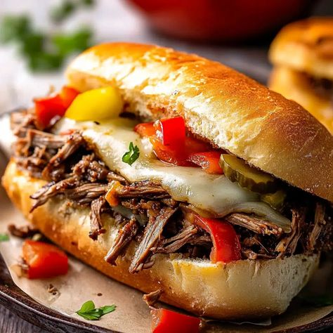 Crockpot Italian Beef Sandwich Recipe - avarecipes.com Crock Pot Beef Sandwiches, Side Dishes For Italian Beef Sandwiches, Hot Italian Beef Sandwiches, Chicago Italian Beef Sandwiches, Italian Beef Sandwiches Crockpot, Hot Italian Sandwiches, Italian Drip Beef, Crockpot Italian Beef, Beef Sandwiches Crock Pot