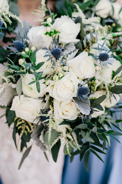 Wedding Bouquet With Blue Thistle, Blue Tweedia Flower, White And Thistle Wedding Flowers, White And Navy Bridal Bouquet, White Rose Thistle Bouquet, White Bouquet With Blue Thistle, Blue Thistle Wedding Flowers, White Roses Blue Thistle Bouquet, Berry Winter Wedding