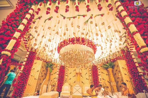 Photo of Elaborate red and white mandap with hanging floral strings Telugu Marriage Decoration, Pelli Mandapam Decoration Telugu, Mandapam Decoration South Indian, Pelli Mandapam Decoration South Indian, Telugu Wedding Decoration, Mandapam Decoration, Shaadi Vibes, Wedding Centerpieces Diy Rustic, Party Arch