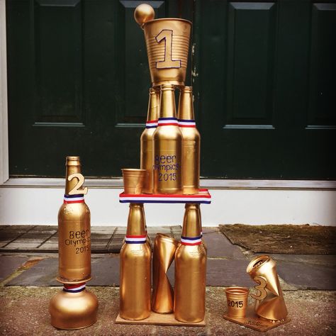 Beer Olympics trophy #beerolympics #beerolympicstrophy Beer Pong Trophy Diy, Beer Olympic Trophies, Beer Olympics Trophy Diy, Beer Olympics Trophy, Beer Pong Trophy, Beer Trophy, Beer Olympics Party, Beer Olympics Games, Beer Pong Party