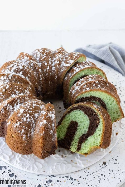 Indulge in a slice of heaven with our mouthwatering Pistachio Bundt Cake! Made with a cake mix, sour cream, and instant pistachio pudding mix, this dessert is a perfect balance of flavors and textures. Moist, rich, and bursting with pistachio goodness, this bundt cake is sure to impress. Get ready to tantalize your taste buds with each delightful bite. Don't miss out on this incredible recipe – pin it now! Pistachio Bundt Cake With Sour Cream, Pistachio Cake Chocolate, Chocolate Pistachio Bundt Cake, Instant Pistachio Pudding Recipes, Pistachio Bundt Cake Recipes, Pistachio Pudding Bundt Cake, Pistachio Chocolate Cake, Cake Mix Sour Cream, Chocolate Pistachio Cake