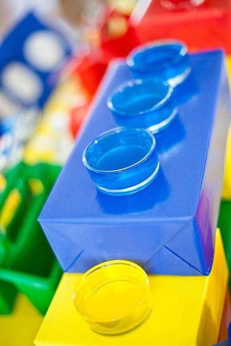 Cover a tissue box with wrapping paper, cut a few holes, and put plastic cups in them. | How To Throw The Ultimate LEGO Birthday Party Lego Invitation, Lego Movie Party, Lego Themed Party, Ninjago Birthday, Ninjago Party, Lego Birthday Party, Lego Blocks, Lego Birthday, Lego Party