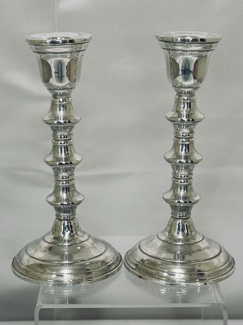 Pair of Sterling Weighted 7" Tall Candlestick Holder possibly made by International Silver Company.  I don't know who made these. There's no maker's mark. There probably was a sticker that fell off. I don't find an exact match, so I'm not sure who made them. I think they might be International Silver Company from the 1960s/1970s.  They're sterling with weighted bases and have a bit of a stacked design. This item was previously owned. It may have some minor scuffs and scratches that are not show Tall Candlesticks, White Chalk, Maker's Mark, The 1960s, Candlestick Holders, Makers Mark, Home Fragrances, Candle Decor, Silver Plate