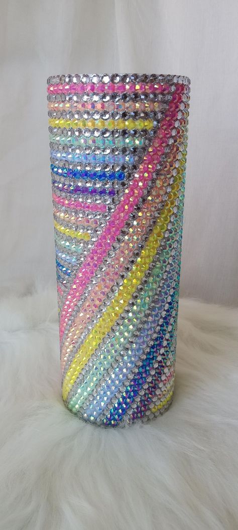 20oz stainless steel cup with lid and straw (not photographed).  Great for iced & hot beverages.  This full cup has been hand rhinestoned with crystal clear/silver & rainbow pastel rhinestones. The white & pastel rhinestones used have an aurora borealis (ab) finish that adds a ton of extra sparkle and color to the design. Cup diameter is approx. 3inches. Hand wash only.  Not dishwasher safe.  Not microwave/stove/oven safe. Glitter And Rhinestone Tumbler, Bedazzled Cup, Rhinestone Tumbler Ideas, Things To Bedazzle, Bling Cups Rhinestones, Rhinestone Filled Tumbler, Transparent Rhinestone Tumbler, Rainbow Rhinestone Tumbler, Diy Rhinestone Crafts