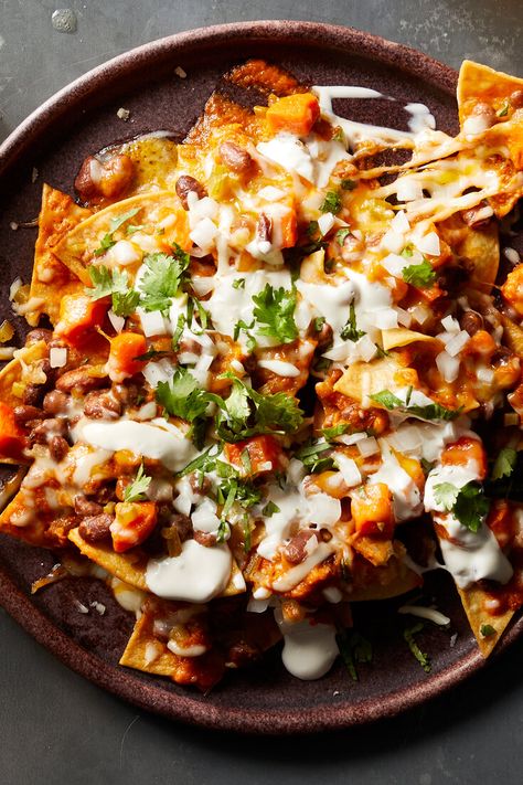 Vegetarian Bean and Cheese Enchiladas Recipe - NYT Cooking Spicy Salsa Recipe, Tomato Snacks, Bean Nachos, Nacho Toppings, New York Times Cooking, Spicy Salsa, Cooked Carrots, Nachos Recipe, Nyt Cooking