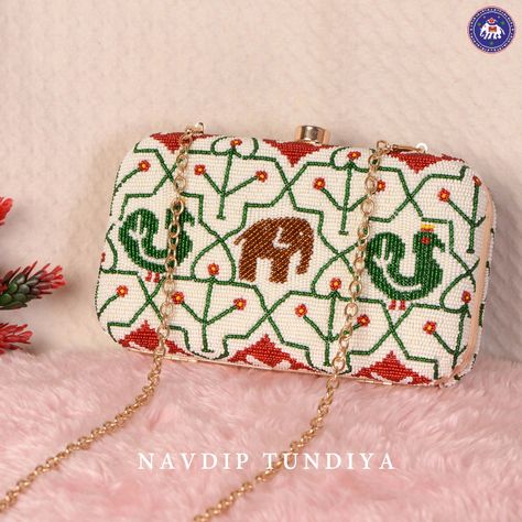 Design : Its in traditional Nari Kunj

Batva: Moti Patola Beaded Clutch

Base Color : White

Material : Moti Hand Work Potli Bag, Potli Bags, Beaded Clutch, Hand Work, White Material, Base Colour, Clutches, Hand Weaving, Color White