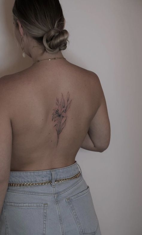 Lily Tattoos For Women Back, Lily Flower Tattoos Back, Tiger Lily Tattoo On Back, Lilly Back Tattoo Women, Lily Back Tattoo For Women, Dainty Flower Back Tattoo, Open Lily Tattoo, Lily Tattoo Back, Lily Flower Back Tattoo