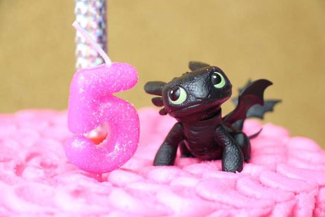 Toothless Girly Birthday | CatchMyParty.com How To Train Your Dragon Centerpiece, How To Train Your Dragon Pinata, How To Train Your Dragon Movie Night, How To Train Your Dragon Birthday Party Decorations, How To Train Your Dragon Party Favors, Dragon Birthday Party Ideas, Httyd Party, Dragon Themed Birthday Party, Dragon Birthday Party