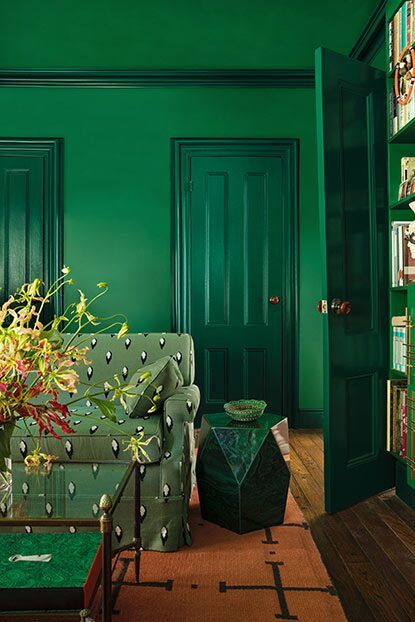 Further, paint sheen is used creatively, with walls in flat matte Amazon Moss 2037-10 contrasted with doors in semi-gloss Rainforest Foliage 2040-10. Jewel Tone Paint Colors, Rainforest Foliage, Stone End Table, Maximalist Painting, Modern Maximalism, Emerald Green Paint, Maximalist Interior Design, Bold Paint Colors, Maximalist Interior