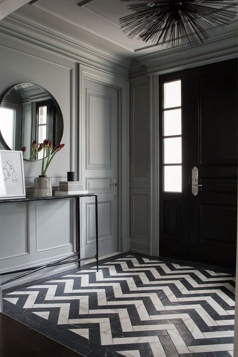 Elegant Home Entryway + Chevron Floor Tile + Herringbone Tile + Black and White + Gray Wainscoting _ Gray Door Trim + Contemporary Light Fixture + Circle Mirror + + Entryway Table | Design by Meg Cassidy Creative  | Photography by Lauren Miller Black And White Floor, White Floor, Interior Stylist, Contemporary Interior Design, Floor Patterns, Classic Interior, Floor Design, Modern Family, Contemporary Decor