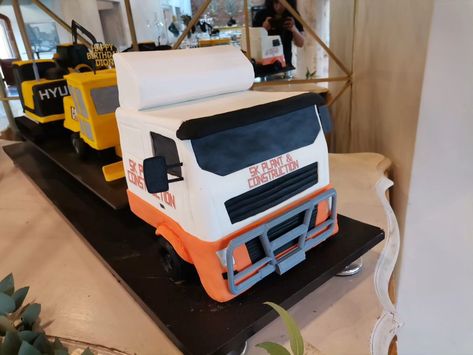 Flatbed Truck and Construction Vehicle 3D Cake! This incredible set was massive and weighed a ton! It’s likely the biggest cake we’ve made so far. Each cake measured approximately 27cm, excluding their attachments, and the board they sat on measured 1.8 meters. Our client had to custom-make a table to support these enormous cakes. Months of studying these vehicles and meticulous planning went into constructing these cakes, and we’re thrilled to see them come to life. We thoroughly enjoyed w... Chocolate Fudge Filling, Fruit Cake Filling, Excavator Cake, Biggest Cake, Chocolate Coconut Cake, Chocolate Fudge Icing, Fudge Icing, Cake Almond, Flatbed Truck