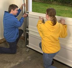 How to Install a Garage Door | HomeTips Garage Door Installation Diy, Door Framing, Garage Door Framing, Faux Wood Garage Door, Bob Villa, Barn Remodel, Installation Ideas, Garage Door Replacement, Garage Door Types