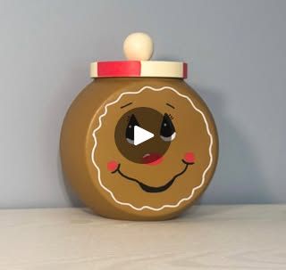 844K views · 8.6K reactions | Dollar Tree Candy Jar Makeover | Gingerbread Decor DIY | By We Craft Around | Hey, everybody. It's Beth. Jam
using this plastic candy jar from Dollar Tree. The jar I am
painting with hazelnut chalk paint by Waverly and I'm using
a sponge to apply it. It just adheres better and gives better
coverage than using a paint brush. I give that full
coverage and then I paint the lid with antique white acrylic
paint that I also gave full coverage. Once that's dry, I
take a craft stick and mark off three sections and then mark
those three sections in half again. I then follow those lines down
onto the side of the lid. I'm using my Pasca paint pens to
fill in those lines. And then I just kind of mark off those
sections that I'm painting red with the X. And then I followed Dollar Tree Candy Jar, Cookie Jars Diy, Jam Jar Crafts, Gingerbread Diy Crafts, Candy Jars Diy, Plastic Candy Jars, Easy Winter Crafts, Christmas Bows Diy, Gingerbread Decor