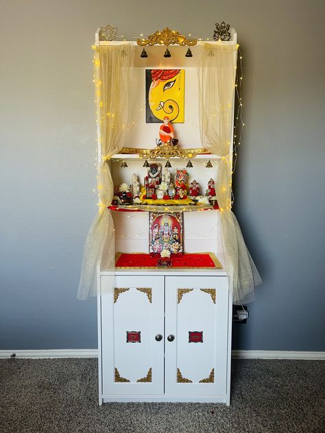 Instead of buying a traditional Mandir here in US(which could cost me an arm and a leg😩), I made my own Mandir with using an IKEA cabinet and some DIY hacks. Sharing glimpses of my work and my new mandir Diy Mandir Ideas Ikea, Pooja Mandir Diy Ikea Hacks Usa, Pooja Mandir Cabinet, Ikea Mandir Hack, Diy Puja Mandir Home, Diy Pooja Mandir Usa, Ikea Pooja Mandir, Mandir Diy Ideas, Diy Pooja Mandir Ikea Hacks