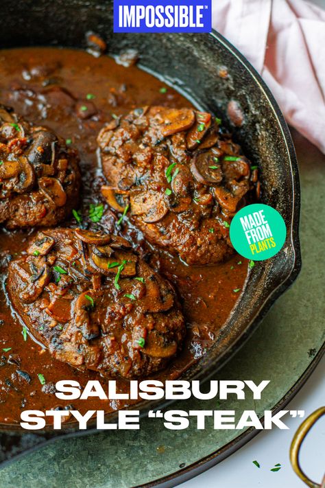 This Impossible™ Salisbury-Style “Steak” recipe is the meatier, grown-up version of this classic dish. The recipe calls for Impossible™ Burger steaks, smothered in a rich umami mushroom gravy that will have your entire family craving a second serving. Hearty, tender, and flavorful – it's the perfect way to end the evening! Find more recipes from Meiko on at @meikoandthedish! Impossible Steak Recipe, Impossible Salisbury Steak, Vegan Salisbury Steak Beyond Meat, Vegetarian Salisbury Steak, Vegan Cubed Steak, Grown Beef Recipes Dinners, Vegan Salsberry Steak Recipe, Plant Based Steak Recipes, Vegetarian Steak Alternative