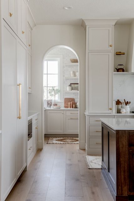 Kitchen features a pantry with an arched doorway. White Kitchen Pantry Cabinet, Dutch Cottage, White Kitchen Pantry, Kitchen Canopy, Arched Doorway, Arch Doorway, Pantry Cabinets, Project Portfolio, Butlers Pantry