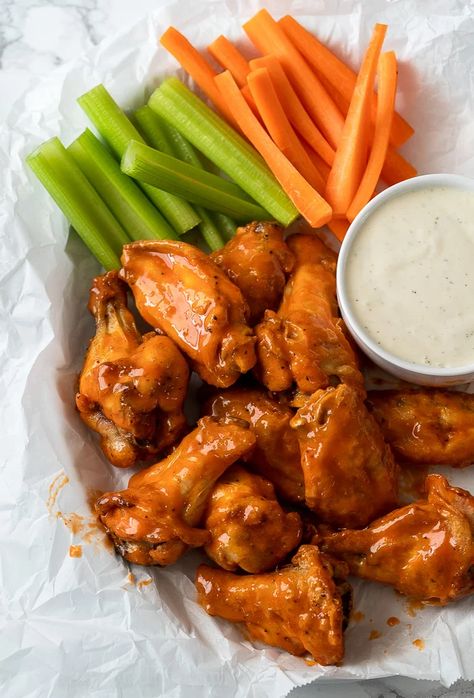 Saucy Buffalo Wings in basket with celery and carrots and a side of ranch dressing Honey Bbq Wings, Hot Chicken Wings, Buffalo Hot Wings, Baked Chicken Wings Oven, Crispy Oven Baked Chicken, Wings Recipe Buffalo, Big Dinner, Oven Baked Chicken Breasts, Crispy Wings