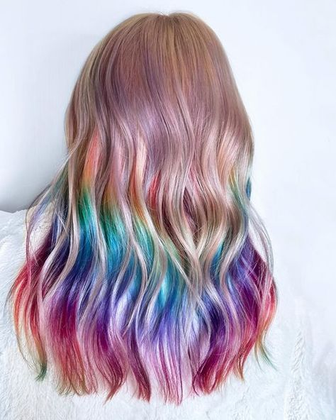 Sheree gaff on Instagram: "Time for some colour 🌈 Swipe to see the process and before photo  * First I pre lightened the regrowth * then on dry hair I sectioned out the top where the blonde was staying and began applying the rainbow colours underneath 1st Once the colours had been on for 10mins I sprayed down the top/blonde so it was damp then applied the toner for the remaining 10mins. * Rinse the rainbow off first in cold water then rinse it all combined.  * I could still see some of that old bluey green tone through the top, so I went over it on damp hair at the basin with a pastel pink and it gave a beautiful pastel purple hue. Not mad 😎 * Pro tip, NEVER SHAMPOO a vivid colour off.  Only rinse and condition in cold water.  * Styling with @minttools curling iron using @glidehairtools Hair 2024, Green Tone, Rainbow Colours, Instagram Time, Pastel Purple, Green Tones, Curling Iron, Purple Hues, Grey Hair