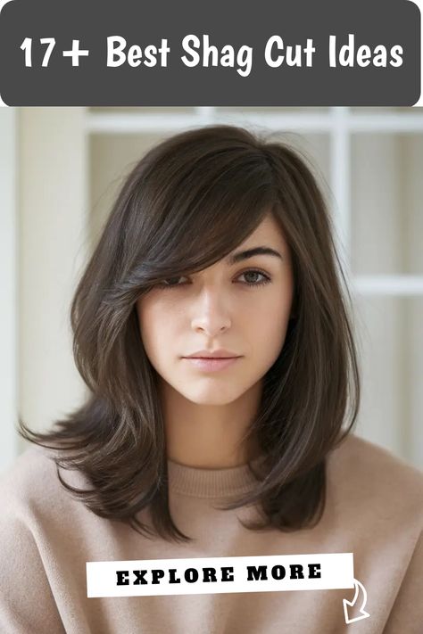 Woman with medium-length shag haircut, styled with side-swept bangs, wearing a beige sweater. Low Maintenance Wavy Haircut, Shag Cut With Bangs, Shag Haircut Ideas, Wavy Haircut, Shag Cut, Different Curls, Modern Mullet, Curly Hair Types, Wavy Haircuts