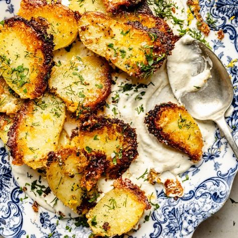 Easy, crispy parmesan roasted potatoes with fresh lemon and herbs. Serve these savory parmesan potatoes with an incredible roasted garlic feta dip alongside your favorite mains and proteins! The perfect side dish for any dinner table. Garlic Feta Dip, Feta Potatoes, Potatoes With Feta, Tahini Sauce Recipe, Crispy Parmesan Potatoes, Cashew Cream Sauce, Parmesan Roasted Potatoes, Pistachio Pesto, Oven Roasted Potatoes